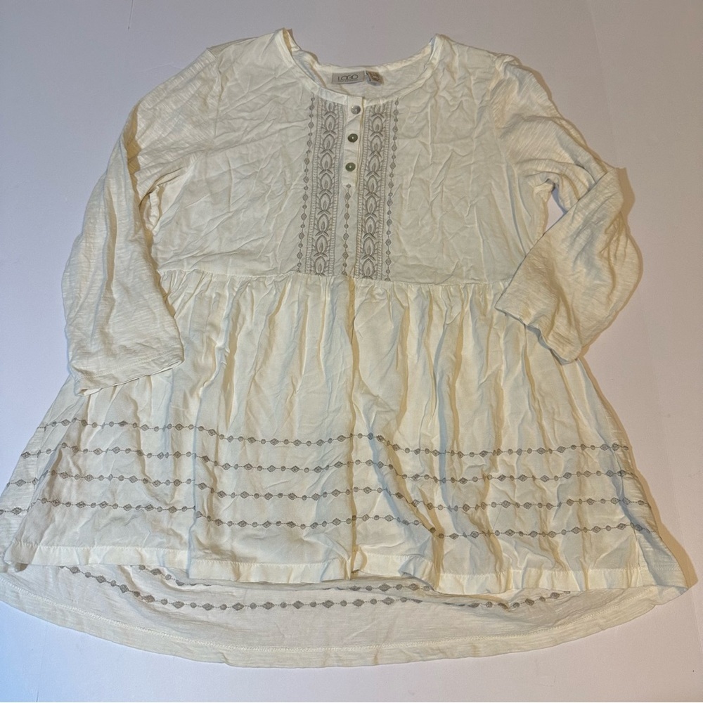 Logo by Lori Goldstein embroidered top